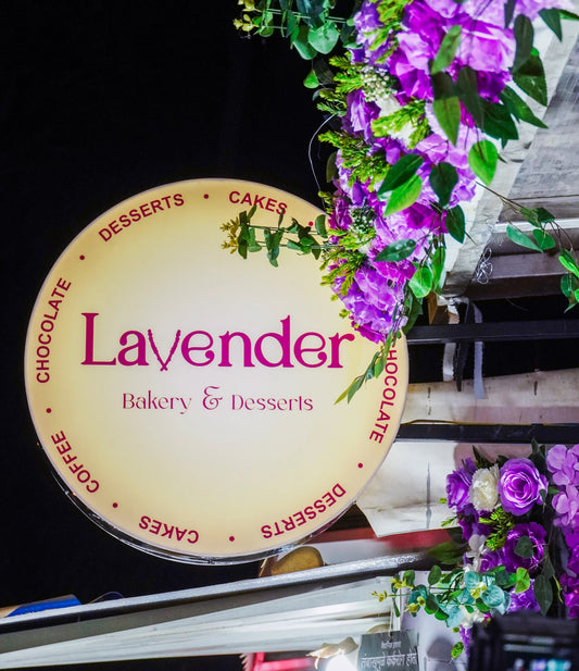 Lavender Bakery & Desserts sign with flowers in the foreground