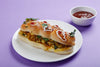 Paneer Hot Dog filled with seasoned paneer, vegetables and sauces