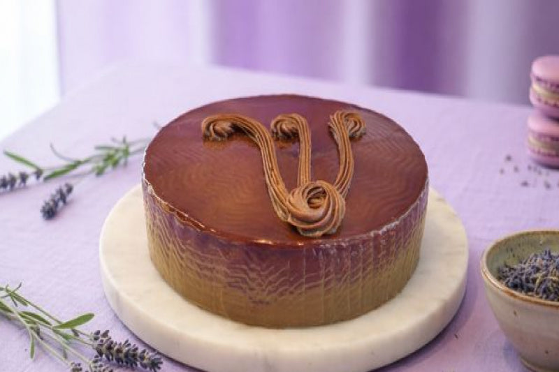 Milk Chocolate Cake with soft chocolate sponge, creamy milk chocolate frosting, and elegant chocolate decoration.
