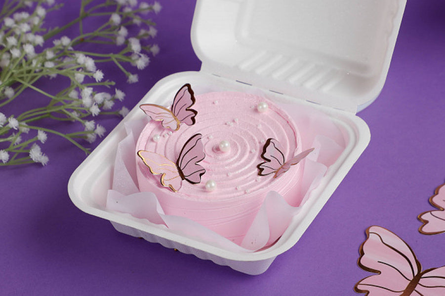 Belgian Chocolate Butterfly-Themed Bento Cake with pink frosting and elegant butterfly decorations, presented in a white bento box.