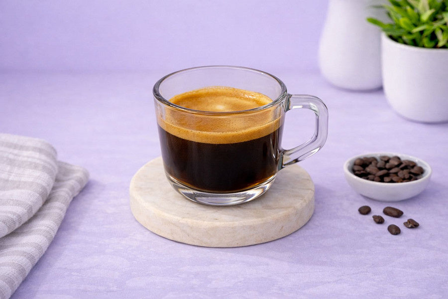 Freshly brewed espresso coffee with golden crema
