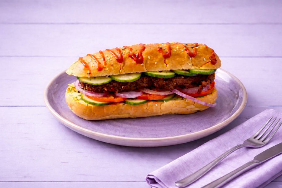 Veg Hot Dog filled with vegetable patty, fresh vegetables and sauces