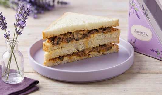 Toasted Mushroom and Cheese Sandwich filled with juicy mushrooms and melted cheese, served on a plate.